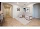 Bright and airy living room with two armchairs and a rug at 121 Whirlaway Dr, Davenport, FL 33837