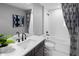 Clean bathroom with white tile, bathtub, and modern vanity at 12455 Shipwatch St, Orlando, FL 32832