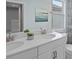 Double vanity bathroom with white cabinets and quartz countertops at 12463 Shipwatch St, Orlando, FL 32832