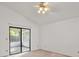 Bright bedroom with sliding glass doors leading to a patio at 1360 Cherrybark Rd, Apopka, FL 32703