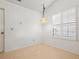 Small dining area with light walls and honeycomb flooring, featuring a window with white shutters at 1360 Cherrybark Rd, Apopka, FL 32703