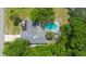 Overhead view of single Gathering home with pool and lush landscaping at 1365 Indian Rock Ct, Deltona, FL 32725