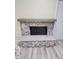 Stone fireplace with light grey mantel and hearth at 1365 Indian Rock Ct, Deltona, FL 32725