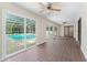 Spacious lanai with tile floors and sliding glass doors to the pool at 1365 Indian Rock Ct, Deltona, FL 32725