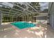 Inviting rectangular pool with a screened enclosure at 1365 Indian Rock Ct, Deltona, FL 32725