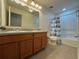 Bathroom with tub, shower, and double vanity at 13731 Bravante Aly, Windermere, FL 34786