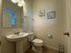 Clean and simple powder room with white fixtures at 13731 Bravante Aly, Windermere, FL 34786