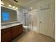 Modern bathroom featuring double sinks and a shower/tub combo at 13731 Bravante Aly, Windermere, FL 34786