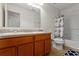 Bright bathroom features double sinks, granite countertops, and shower with blue patterned curtain at 13731 Bravante Aly, Windermere, FL 34786