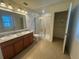 Bathroom features double vanity and shower at 13731 Bravante Aly, Windermere, FL 34786