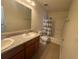 Bathroom boasts double vanity and shower/tub at 13731 Bravante Aly, Windermere, FL 34786