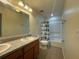 Bathroom with tub, shower, and double vanity at 13731 Bravante Aly, Windermere, FL 34786