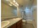 Bathroom with tub, shower, and double vanity at 13731 Bravante Aly, Windermere, FL 34786