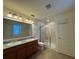 Bathroom boasts double sinks, granite countertops, and a shower at 13731 Bravante Aly, Windermere, FL 34786