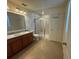 Double vanity bathroom with shower and linen closet at 13731 Bravante Aly, Windermere, FL 34786