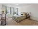 Bright bedroom with two large windows, cozy bed and elegant decor at 13731 Bravante Aly, Windermere, FL 34786