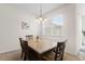 Cozy dining area featuring a stylish light fixture, perfect for intimate meals and gatherings at 13731 Bravante Aly, Windermere, FL 34786