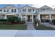 Three-story townhome with front porch and walkway at 13731 Bravante Aly, Windermere, FL 34786