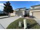 Townhouse exterior with a two-car garage and landscaping at 13731 Bravante Aly, Windermere, FL 34786