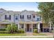 Charming townhome featuring a cozy front porch and beautiful landscaping in a well-maintained community at 13731 Bravante Aly, Windermere, FL 34786