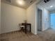 Small hallway with a desk and chair, leading to bedrooms at 13731 Bravante Aly, Windermere, FL 34786