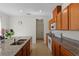 Bright kitchen with stainless steel appliances, granite countertops, and ample cabinet space at 13731 Bravante Aly, Windermere, FL 34786