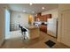 Kitchen with island, granite counters, and wood cabinets at 13731 Bravante Aly, Windermere, FL 34786