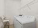 Functional laundry room with modern washer and dryer, and wire shelving at 13731 Bravante Aly, Windermere, FL 34786