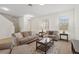 Inviting living room with neutral tones, comfortable seating, and ample natural light creating a relaxing atmosphere at 13731 Bravante Aly, Windermere, FL 34786
