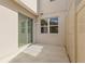 Private outdoor patio with sliding glass door and vinyl fence, offering a secluded retreat at 13731 Bravante Aly, Windermere, FL 34786