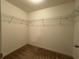 Large walk-in closet with wire shelving for convenient storage at 13731 Bravante Aly, Windermere, FL 34786