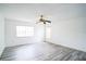 Spacious bedroom with wood-look floors and ceiling fan at 1468 Patricia St, Kissimmee, FL 34744