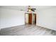 Bedroom with wood-look floors and access to bathroom at 1468 Patricia St, Kissimmee, FL 34744