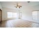 Bright living room featuring tile floors and large windows at 1468 Patricia St, Kissimmee, FL 34744