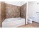 Bathroom with a bathtub and tiled floors at 150 E Robinson St # 2512, Orlando, FL 32801