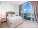 Comfortable bedroom with city view and neutral decor at 150 E Robinson St # 2512, Orlando, FL 32801