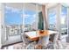 Modern dining area with city views and hardwood floors at 150 E Robinson St # 2512, Orlando, FL 32801