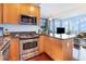 Modern kitchen with granite countertops and stainless steel appliances at 150 E Robinson St # 2512, Orlando, FL 32801