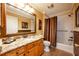 Bathroom with granite countertop, tub, and shower at 1849 Dalton Dr, The Villages, FL 32162