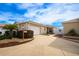 Front view of charming villa with attached garage and landscaped entry at 1849 Dalton Dr, The Villages, FL 32162