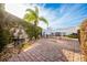 Landscaped patio featuring a water fountain and seating area at 1849 Dalton Dr, The Villages, FL 32162