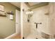 Walk-in shower with marble walls and glass enclosure at 1849 Dalton Dr, The Villages, FL 32162