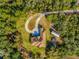 Aerial view of house, circular driveway and detached garage at 1851 Grand Keahl Ln, Deltona, FL 32738