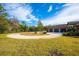 Circular driveway leading to a three-car garage at 1851 Grand Keahl Ln, Deltona, FL 32738