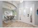 Welcoming foyer with a decorative glass front door and a view into the dining area at 1851 Grand Keahl Ln, Deltona, FL 32738