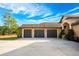 Spacious garage with three bays offers ample parking and storage space for vehicles and other belongings at 1851 Grand Keahl Ln, Deltona, FL 32738
