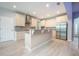 Well-lit kitchen featuring custom cabinets, granite countertops, and stainless steel appliances at 1851 Grand Keahl Ln, Deltona, FL 32738