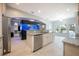 Spacious kitchen with granite countertops, stainless appliances, an island, and an aquarium feature at 1851 Grand Keahl Ln, Deltona, FL 32738