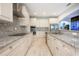 Bright kitchen featuring custom cabinets, granite countertops and stainless steel appliances at 1851 Grand Keahl Ln, Deltona, FL 32738