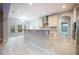 Bright kitchen featuring custom cabinets, granite countertops, and stainless steel appliances at 1851 Grand Keahl Ln, Deltona, FL 32738